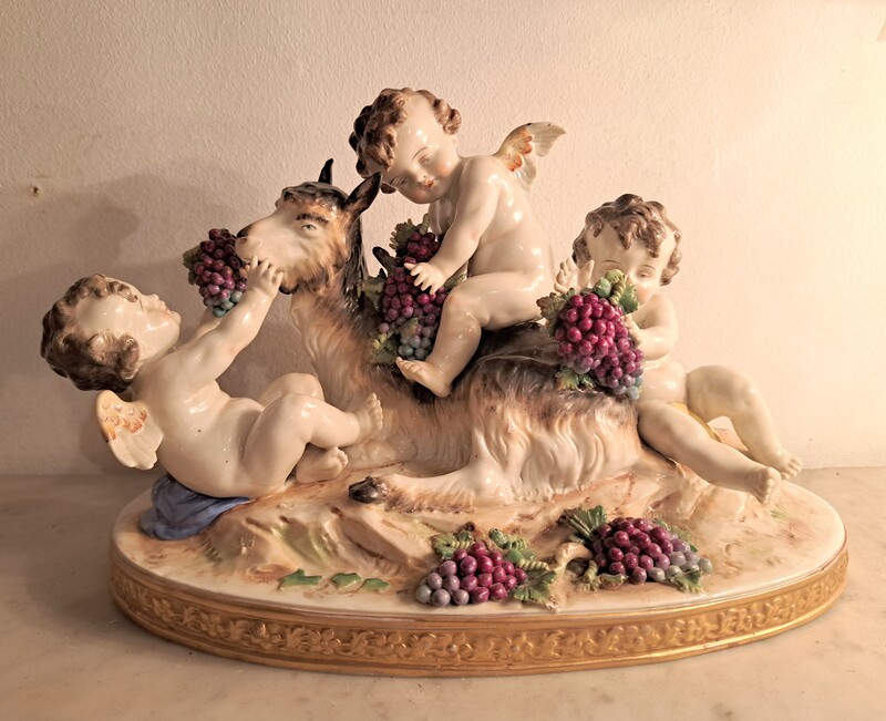 Capodimonte polychrome porcelain group of cherubs and a goat