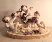 Capodimonte polychrome porcelain group of cherubs and a goat