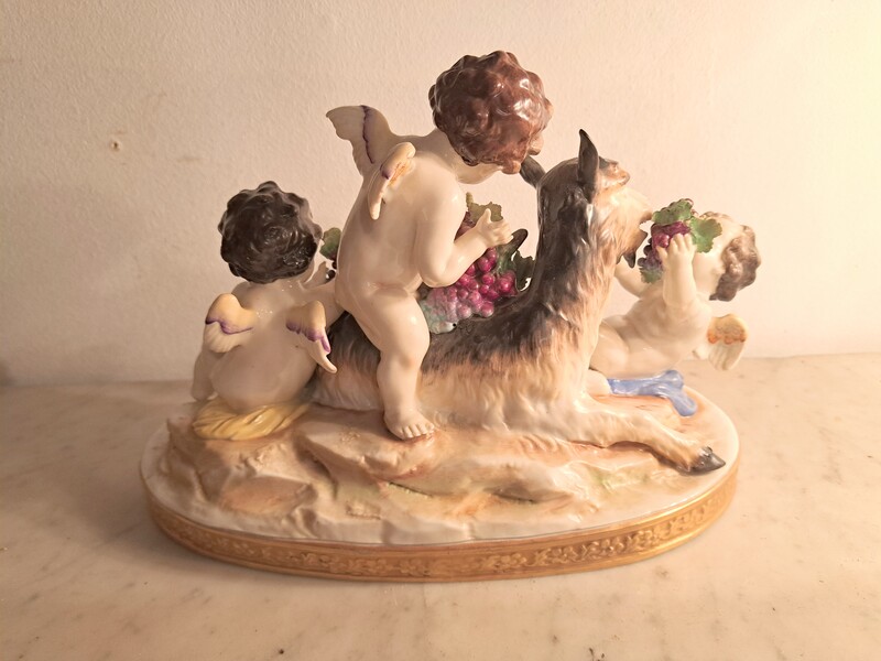 Capodimonte polychrome porcelain group of cherubs and a goat