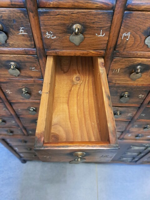 Chinese apothecary cabinet in exotic wood and gilt brass