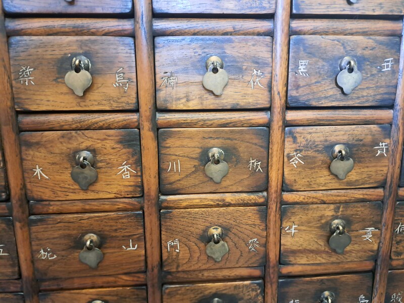 Chinese apothecary cabinet in exotic wood and gilt brass