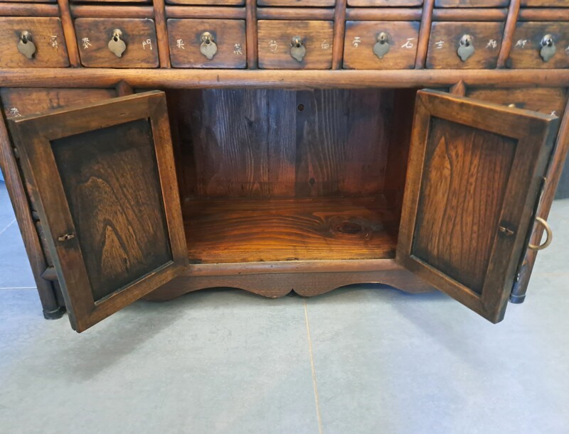 Chinese apothecary cabinet in exotic wood and gilt brass