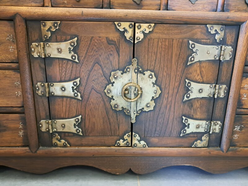 Chinese apothecary cabinet in exotic wood and gilt brass