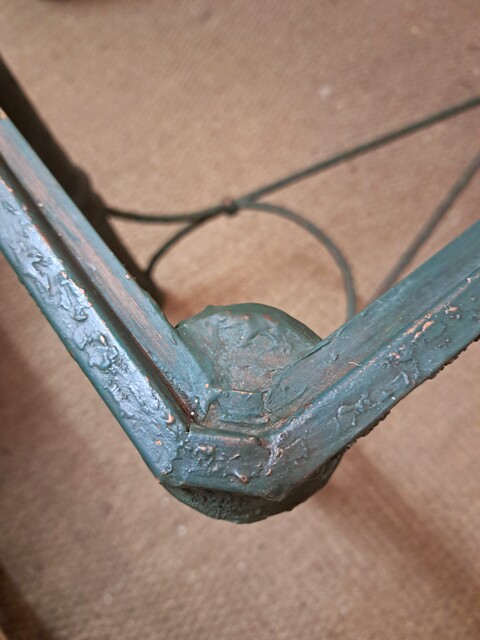 Dark green lacquered wrought iron console table with glass top