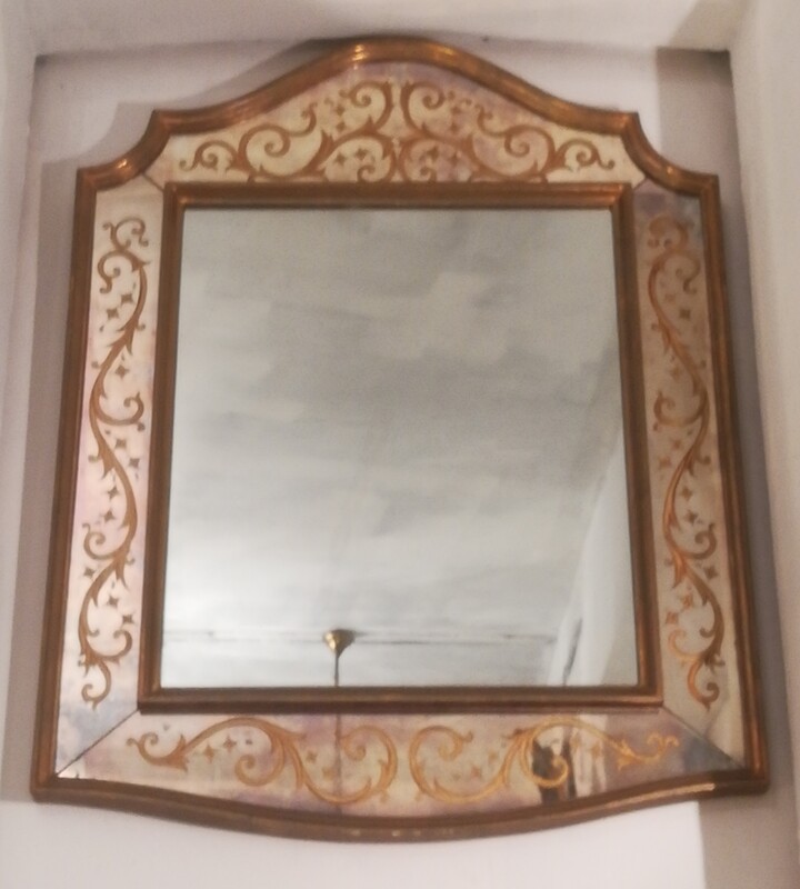 Eglomised glass and gilt wood mirror