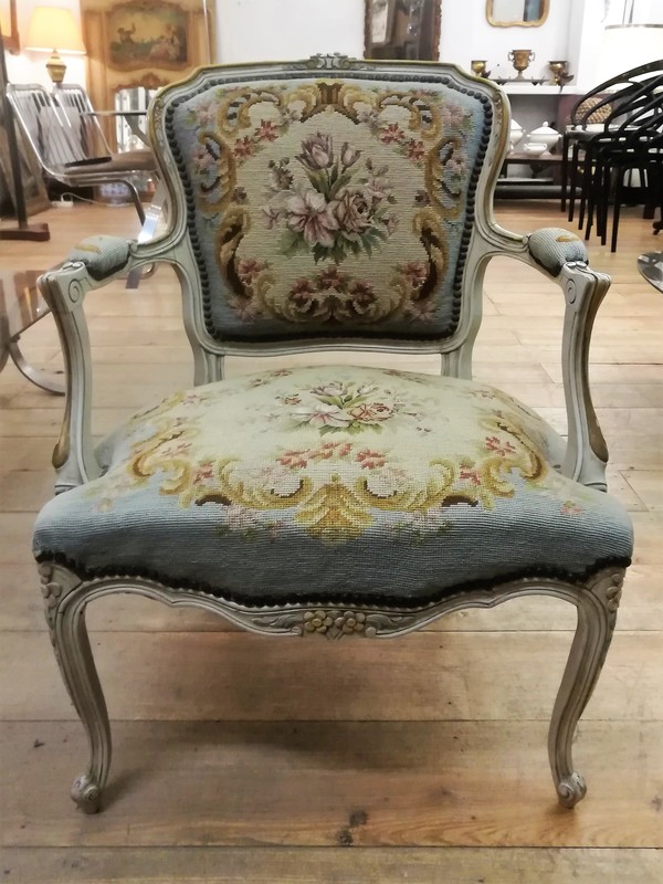 Patinated and upholstered Louis XV style cabriolet armchair 