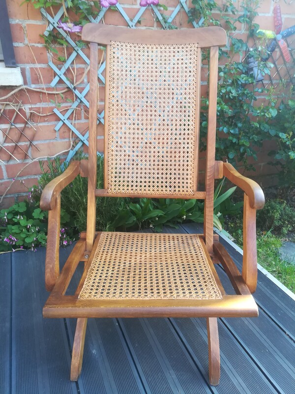Folding caned and beech wood armchair