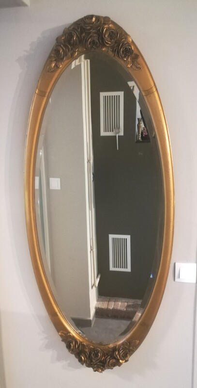 Gilt stucco roses and beveled glass art deco big oval mirror