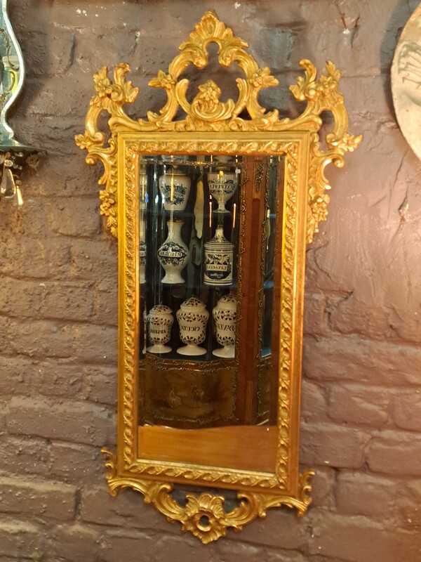 Roccoco style beveled mirror in gilded wood