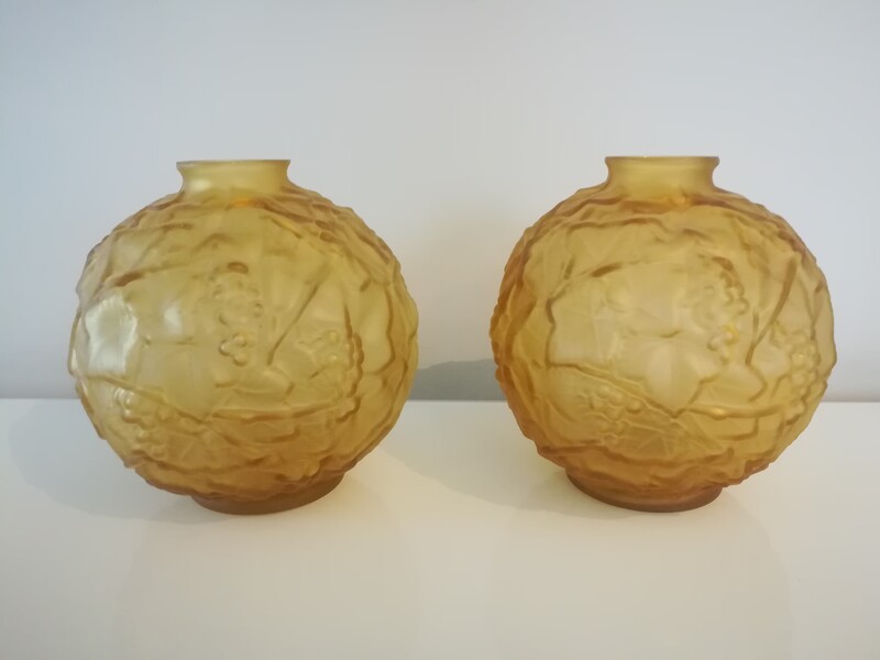 Pair of art deco molded glass vases with vine decoration