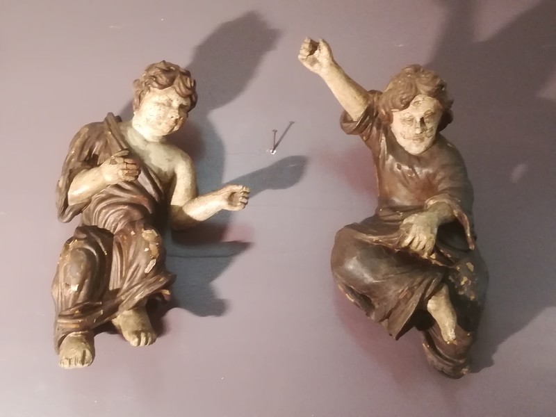 Pair of polychrome carved wooden puttis