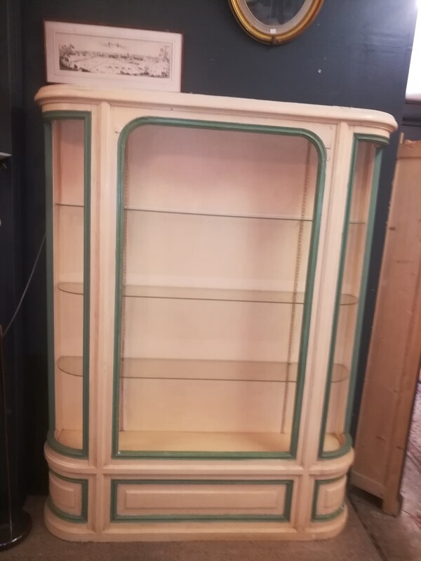 Patinated open curved bookcase