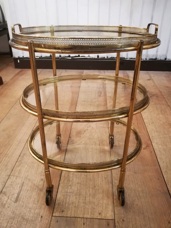 Small brass oval rolling trolley with 3 movable glass trays