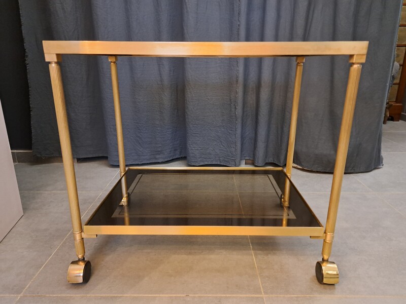 Rolling serving cart in gilded brass with smoked glass tops