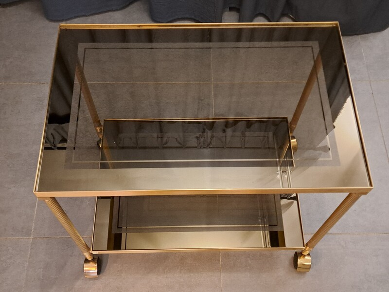 Rolling serving cart in gilded brass with smoked glass tops