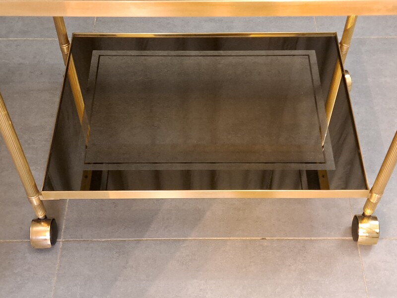 Rolling serving cart in gilded brass with smoked glass tops