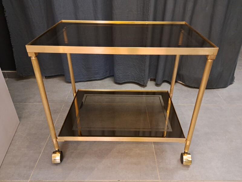 Rolling serving cart in gilded brass with smoked glass tops