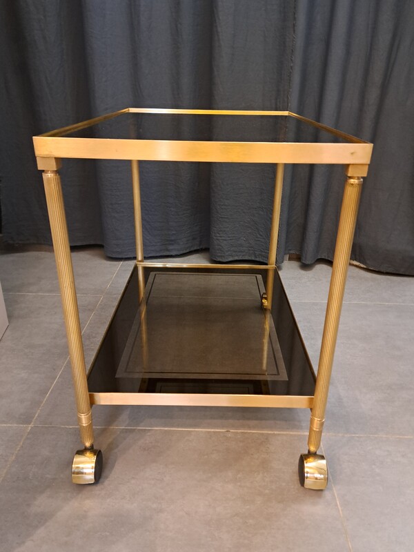 Rolling serving cart in gilded brass with smoked glass tops