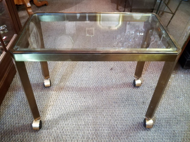 Rolling trolley in brass and smoked glass