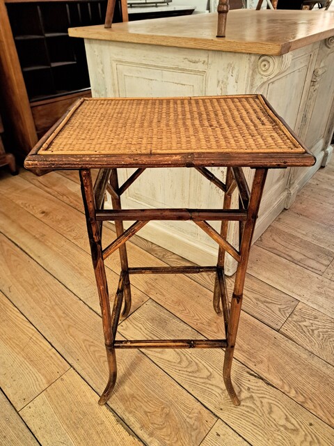Side table made of bamboo and woven straw