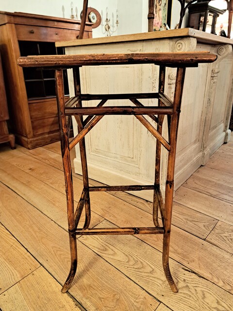 Side table made of bamboo and woven straw