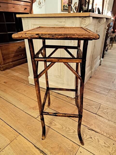Side table made of bamboo and woven straw