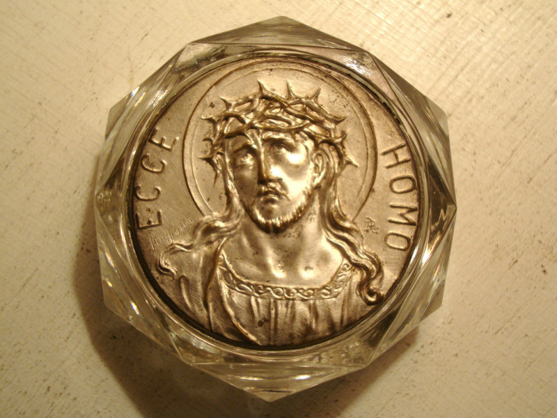 Small medal christ in supporting cut glass