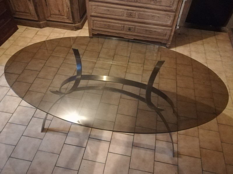 Smocked oval glass top and chrome steel dining table