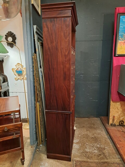  Two-piece mahogany notary's cabinet with hinged doors